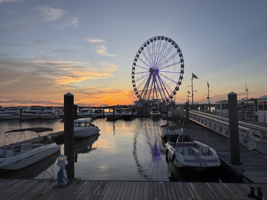 Sunset behind the ferris wheel along the Potomac River in National Harbor, MD